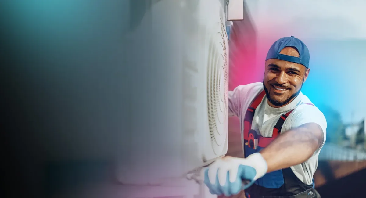 Affordable Air Experts technician servicing an air conditioning unit